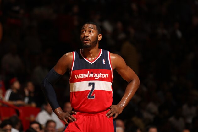 MIAMI, FL - March 10: John Wall #2 of the Washington Wizards looks on against the Miami Heat at the American Airlines Arena in Miami, Florida on March 10 2014. NOTE TO USER: User expressly acknowledges and agrees that, by downloading and/or using this photograph, user is consenting to the terms and conditions of the Getty Images License Agreement. Mandatory copyright notice: Copyright NBAE 2014 (Photo by Issac Baldizon/NBAE via Getty Images)