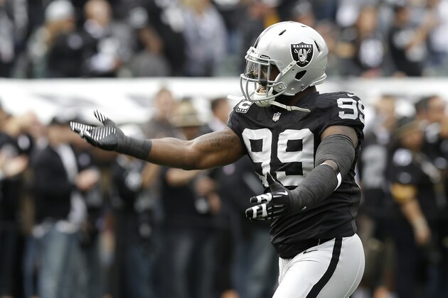 Oakland Raiders defensive end Lamarr Houston (99) before an NFL football game against the Pittsburgh Steelers in Oakland, Calif., Sunday, Oct. 27, 2013. (AP Photo/Ben Margot)