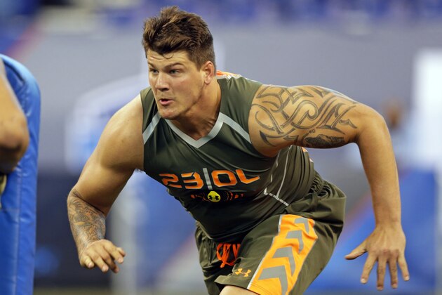 Michigan offensive lineman Taylor Lewan runs a drill at the NFL football scouting combine in Indianapolis, Saturday, Feb. 22, 2014. (AP Photo/Michael Conroy)