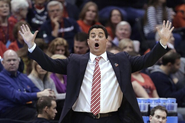 FILE - In this March 23, 2013, file photo, Arizona coach Sean Miller shouts to his team in the first half against Harvard in the NCAA men's college basketball tournament in Salt Lake City. Ed Rush resigned as the Pac-12 Conference's coordinator of officials on Thursday, April 4, 2013, following comments during internal meetings before the league tournament that appeared to target Miller, including perceived accusations that he placed a bounty on the Wildcats coach. (AP Photo/Rick Bowmer, File)