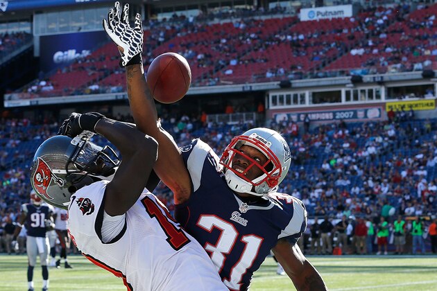 FOXBORO, MA - SEPTEMBER 22:  Aqib Talib #31 of the New England Patriots breaks up a pass intended for Mike Williams #19 of the Tampa Bay Buccaneers during the 4th quarter in a game at Gillette Stadium on September 22, 2013 in Foxboro, Massachusetts. (Photo by Jim Rogash/Getty Images)