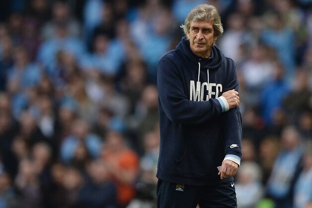 MANCHESTER, ENGLAND - MARCH 09:  Manchester City manager Manuel Pellegrini looks dejected during the FA Cup Quarter-Final match between Manchester City and Wigan Athletic at the Etihad Stadium on March 9, 2014 in Manchester, England.  (Photo by Michael Regan/Getty Images)