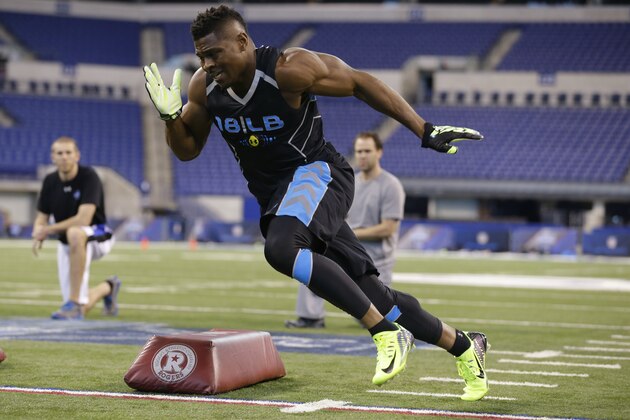 Buffalo linebacker Khalil Mack runs a drill at the NFL football scouting combine in Indianapolis, Monday, Feb. 24, 2014. (AP Photo/Michael Conroy)