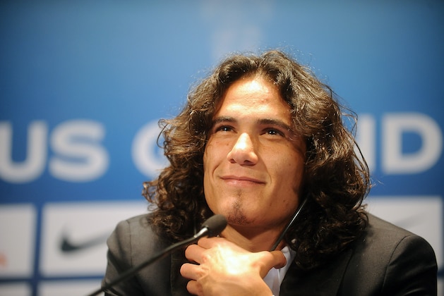 PARIS, FRANCE - JULY 16: Paris Saint-Germain's (PSG) new forward, Edinson Cavani, attends a press conference on July 16, 2013 in Paris, France. Cavani's transfer to Paris Saint-Germain football club is reported to have cost in the region of £55m. (Photo by Antoine Antoniol/Getty Images) PARIS, FRANCE - JULY 16: Paris Saint-Germain's (PSG) new forward, Edinson Cavani, attends a press conference on July 16, 2013 in Paris, France. Cavani's transfer to Paris Saint-Germain football club is reported to have cost in the region of £55m. (Photo by Antoine Antoniol/Getty Images)