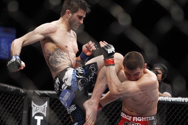 Nick Diaz takes a knee from Carlos Condit during their UFC interim welterweight mixed martial arts title match, Saturday, Feb. 4, 2012 at The Mandalay Bay Resort & Casino in Las Vegas. Condit won by a unanimous decision. (AP Photo/Eric Jamison)