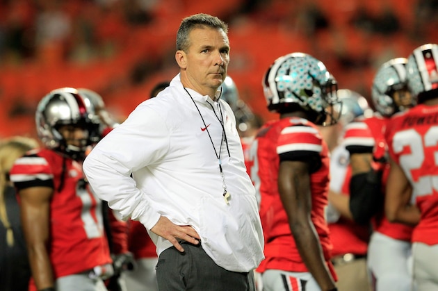 MIAMI GARDENS, FL - JANUARY 03:  Head coach Urban Meyer of the Ohio State Buckeyes looks on during warm ups prior to the Discover Orange Bowl against the Clemson Tigers at Sun Life Stadium on January 3, 2014 in Miami Gardens, Florida.  (Photo by Chris Trotman/Getty Images)
