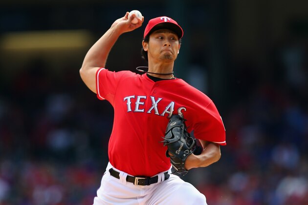 ARLINGTON, TX - SEPTEMBER 29:  Yu Darvish #11 of the Texas Rangers throws against the Los Angeles Angels in the first inning at Rangers Ballpark in Arlington on September 29, 2013 in Arlington, Texas.  (Photo by Ronald Martinez/Getty Images)