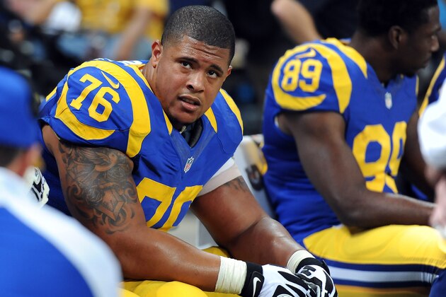 St. Louis Rams offensive tackle Rodger Saffold sits on the bench during the third quarter of an NFL football game against the Tampa Bay Buccaneers Sunday, Dec. 22, 2013, in St. Louis. (AP Photo/L.G. Patterson)