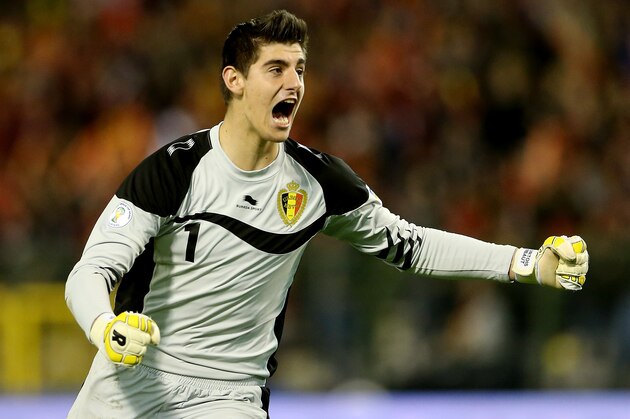 BRUSSELS, BELGIUM - OCTOBER 16:  Thibaut Courtois of Belgium celebrates their first goal during the FIFA 2012 World Cup Qualifier match between Belgium and Scotland on October 16, 2012 in Brussels, Belgium.  (Photo by Scott Heavey/Getty Images)