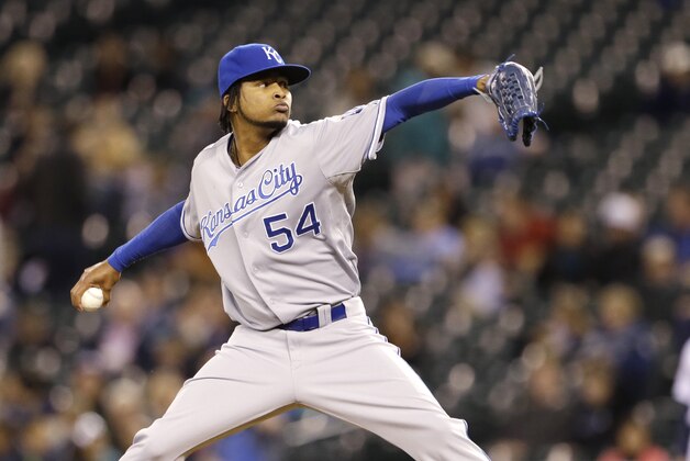 Kansas City Royals starting pitcher Ervin Santana throws against the Seattle Mariners a baseball game Wednesday, Sept. 25, 2013, in Seattle. (AP Photo/Elaine Thompson)