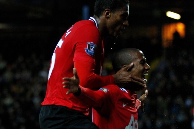BLACKBURN, ENGLAND - APRIL 02:  Ashley Young of Manchester United celebrates scoring his team's second goal with team mate Antonio Valencia (L) during the Barclays Premier League match between Blackburn Rovers and Manchester United at Ewood Park on April 2, 2012 in Blackburn, England.  (Photo by Clive Brunskill/Getty Images)