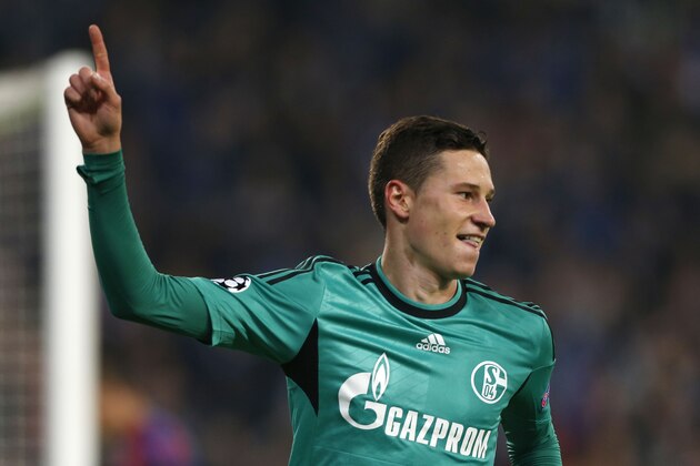 Schalke's Julian Draxler celebrates his side's third goal during the Champions League group E soccer match between Schalke 04 and Steaua Bucharest in Gelsenkirchen, Germany, Wednesday, Sept. 18, 2013. (AP Photo/Frank Augstein)