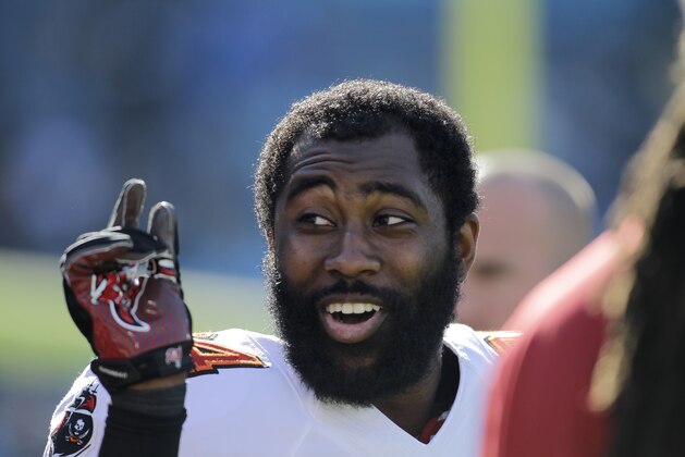 Tampa Bay Buccaneers' Darrelle Revis clowns around with teammates during warm ups before an NFL football game against the Carolina Panthers in Charlotte, N.C., Sunday, Dec. 1, 2013. The Panthers won 27-6. (AP Photo/Bob Leverone) Tampa Bay Buccaneers' Darrelle Revis clowns around with teammates during warm ups before an NFL football game against the Carolina Panthers in Charlotte, N.C., Sunday, Dec. 1, 2013. The Panthers won 27-6. (AP Photo/Bob Leverone)