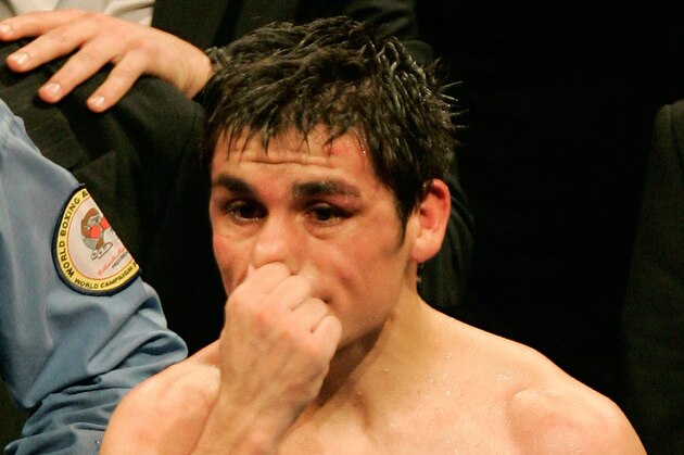 Argentina's light flyweight Juan Carlos Reveco reacts after losing his WBA light flyweight World Champion title against France's boxer Brahim Asloum, Saturday, Dec. 8, 2007, in Le Cannet, southern France.  Asloum won the fight on unanimous decision. (AP Photo/Lionel Cironneau)
