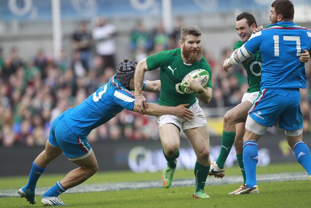 Ireland's Gordon D'Arcy, centre, is tackled by Italy's Michele Campagnaro, left, during their Six Nations Rugby Union international match at the Aviva Stadium, Dublin, Ireland, Saturday, March 8, 2014.  (AP Photo/Peter Morrison)