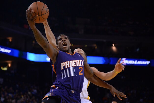 December 27, 2013; Oakland, CA, USA; Phoenix Suns point guard Eric Bledsoe (2) drives to the basket against Golden State Warriors point guard Stephen Curry (30) during the first quarter at Oracle Arena. Mandatory Credit: Kyle Terada-USA TODAY Sports