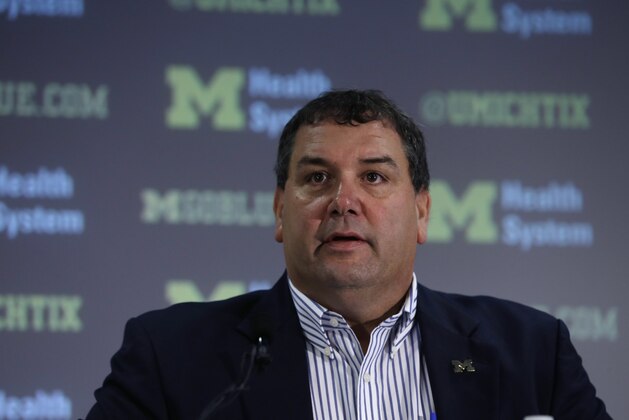 Michigan head football coach Brady Hoke addresses the media before introducing Doug Nussmeier as Michigan's offensive coordinator and quarterbacks coach in Ann Arbor, Mich., Friday, Jan. 10, 2014. (AP Photo/Carlos Osorio)