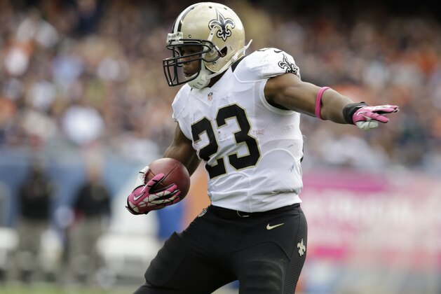 New Orleans Saints running back Pierre Thomas (23) runs with the ball during the first half of an NFL football game against the Chicago Bears, Sunday, Oct. 6, 2013, in Chicago.(AP Photo/Nam Y. Huh)