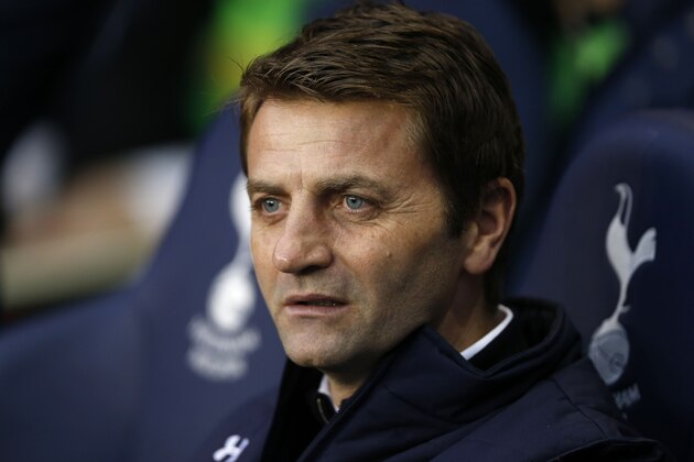 Tottenham Hotspur's manager Tim Sherwood looks on from the dugout before the start of their English Premier League soccer match against Cardiff City at White Hart Lane, London, Sunday, March 2, 2014. (AP Photo/Sang Tan)