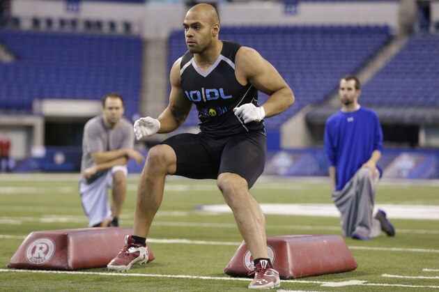 Boston Col defensive lineman Kasim Edebali runs a drill at the NFL football scouting combine in Indianapolis, Monday, Feb. 24, 2014. (AP Photo/Michael Conroy)
