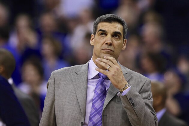 Villanova coach Jay Wright looks at the score board in the second half of an NCAA college basketball game against Creighton in Omaha, Neb., Sunday, Feb. 16, 2014. Creighton won 101-80. (AP Photo/Nati Harnik)