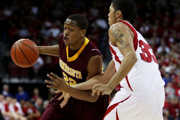 MADISON, WI - JANUARY 15: Devron Bostick #22 of the Minnesota Golden Gophers moves against Rob Wilson #33 of the Wisconsin Badgers on January 15, 2009 at the Kohl Center in Madison, Wisconsin. Minnesota defeated Wisconsin 78-74 in overtime.  (Photo by Jonathan Daniel/Getty Images)