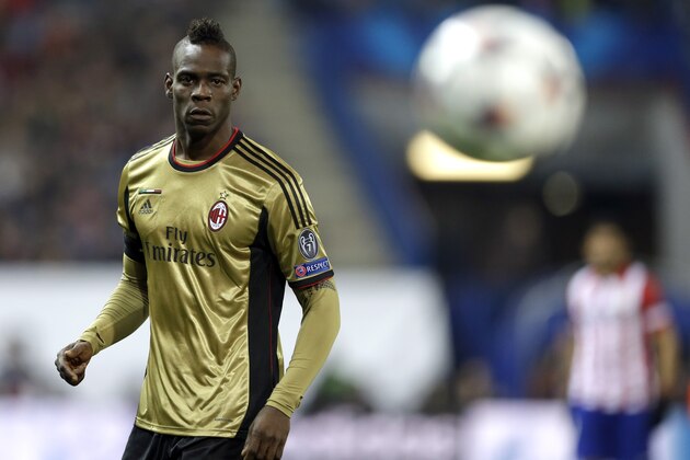 AC Milan's Mario Balotelli eyes the ball during a Champions League, round of 16, second leg, soccer match between Atletico Madrid and AC Milan at the Vicente Calderon stadium in Madrid, Tuesday March 11, 2014. (AP Photo/Paul White)