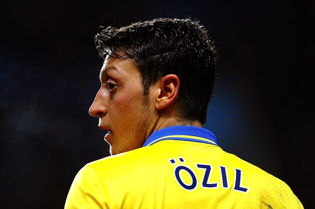 BIRMINGHAM, ENGLAND - JANUARY 13:  Mesut Oezil of Arsenal looks on during the Barclays Premier League match between Aston Villa and Arsenal at Villa Park on January 13, 2014 in Birmingham, England.  (Photo by Laurence Griffiths/Getty Images)