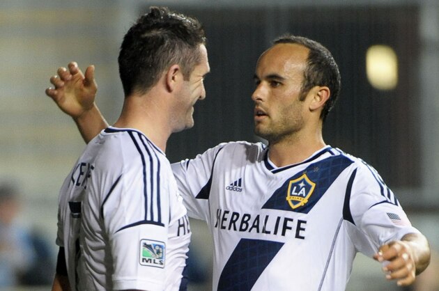 May 15, 2013; Chester, PA, USA; Los Angeles Galaxy midfielder Landon Donovan (10) celebrates his goal with Los Angeles Galaxy forward Robbie Keane (7) against the Philadelphia Union during the second half at PPL Park. The Galaxy defeated the Union, 4-1. Mandatory Credit: Eric Hartline-USA TODAY Sports