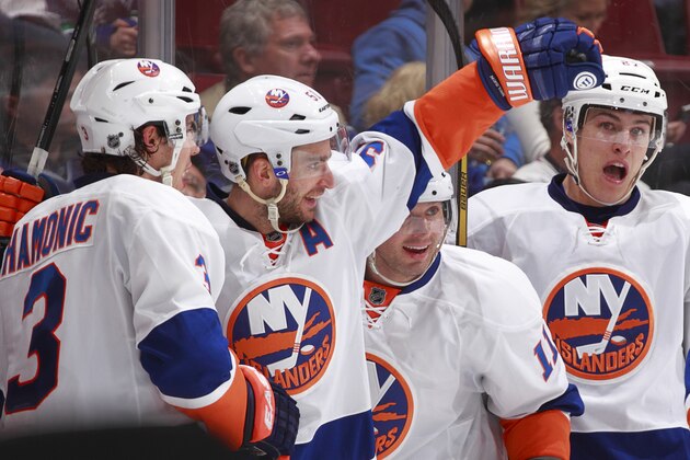 VANCOUVER, BC - MARCH 10: Travis Hamonic #3, Lubomir Visnovsky #11 and Anders Lee #27 of the New York Islanders congratulate Frans Nielsen #51 on scoring one of the seven team third-period goals scored against the Vancouver Canucks during an NHL game at Rogers Arena March 10, 2014 in Vancouver, British Columbia, Canada. The Islanders won 7-4. (Photo by Jeff Vinnick/NHLI via Getty Images) VANCOUVER, BC - MARCH 10: Travis Hamonic #3, Lubomir Visnovsky #11 and Anders Lee #27 of the New York Islanders congratulate Frans Nielsen #51 on scoring one of the seven team third-period goals scored against the Vancouver Canucks during an NHL game at Rogers Arena March 10, 2014 in Vancouver, British Columbia, Canada. The Islanders won 7-4. (Photo by Jeff Vinnick/NHLI via Getty Images)