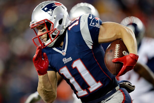 FOXBORO, MA - NOVEMBER 24: Wide receiver Julian Edelman #11 of the New England Patriots runs with the ball against the Denver Broncos during a game at Gillette Stadium on November 24, 2013 in Foxboro, Massachusetts.  (Photo by Jim Rogash/Getty Images)