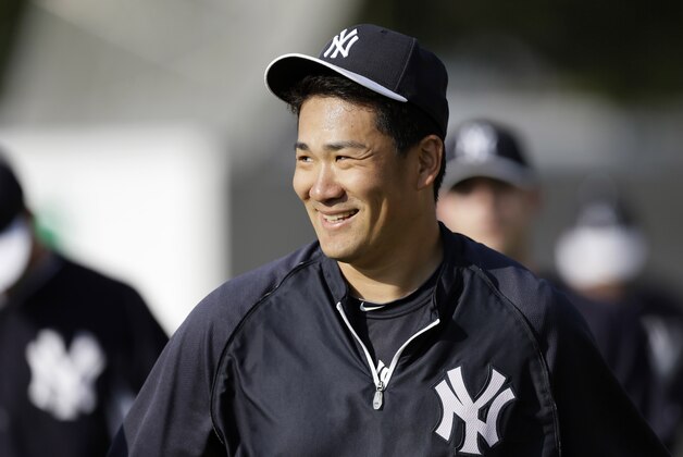 New York Yankees pitcher Masahiro Tanaka walks off a practice field after stretching before the Yankees' exhibition baseball game against the Baltimore Orioles on Tuesday, March 4, 2014, in Tampa, Fla. (AP Photo/Charlie Neibergall) New York Yankees pitcher Masahiro Tanaka walks off a practice field after stretching before the Yankees' exhibition baseball game against the Baltimore Orioles on Tuesday, March 4, 2014, in Tampa, Fla. (AP Photo/Charlie Neibergall)
