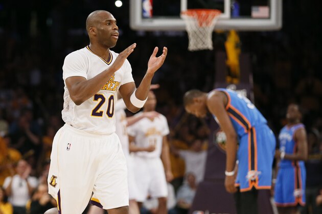 Los Angeles Lakers shooting guard Jodie Meeks, left, celebrates late in the fourth quarter as Oklahoma City Thunder small forward Kevin Durant, right, reaxts during an NBA basketball game in Los Angeles, Sunday, March 9, 2014. The Lakers won 114-110. (AP Photo/Danny Moloshok)