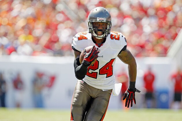 TAMPA, FL - SEPTEMBER 29:  Darrelle Revis #24 of the Tampa Bay Buccaneers runs with the ball against the Arizona Cardinals at Raymond James Stadium on September 29, 2013 in Tampa, Florida.  (Photo by Scott Iskowitz/Getty Images)