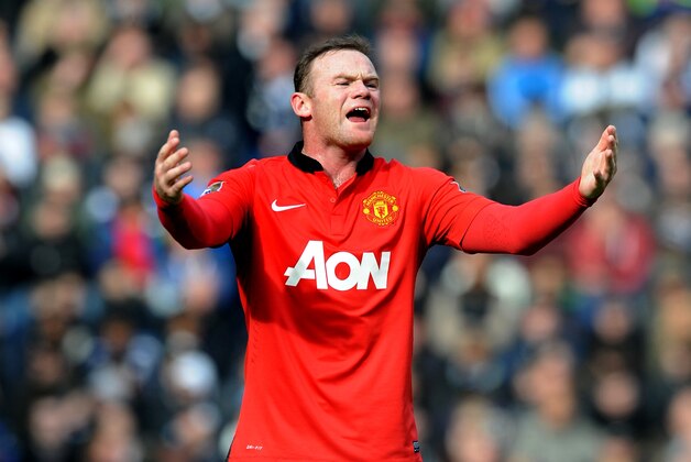 Manchester United's Wayne Rooney shouts instructions to team mates during the English Premier League soccer match between West Bromwich Albion and Manchester United at The Hawthorns Stadium in West Bromwich, England, Saturday, March 8, 2014.  (AP Photo/Rui Vieira)
