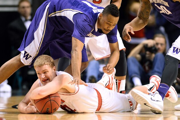 LAS VEGAS, NV - MARCH 12:  Jeremy Olsen #41 of the Utah Utes grabs a loose ball against Darin Johnson #1 of the Washington Huskies during a first-round game of the Pac-12 Basketball Tournament at the MGM Grand Garden Arena on March 12, 2014 in Las Vegas, Nevada.  (Photo by Ethan Miller/Getty Images)
