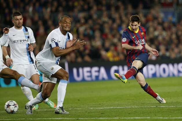 Barcelona's Lionel Messi, right shoots on goal during a Champions League, round of 16, second leg, soccer match between FC Barcelona and Manchester City at the Camp Nou Stadium in Barcelona, Spain, Wednesday March 12, 2014. (AP Photo/Emilio Morenatti)