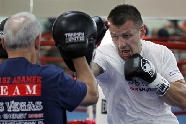 Polish heavyweight boxer Tomasz Adamek, right, spars with trainer Roger Bloodworth at World Boxing and Fitness Center in Jersey City, N.J., Thursday, Aug. 23, 2012. Adamek is scheduled fight Travis Walker on Sept. 8 in Newark, N.J. (AP Photo/Mel Evans)