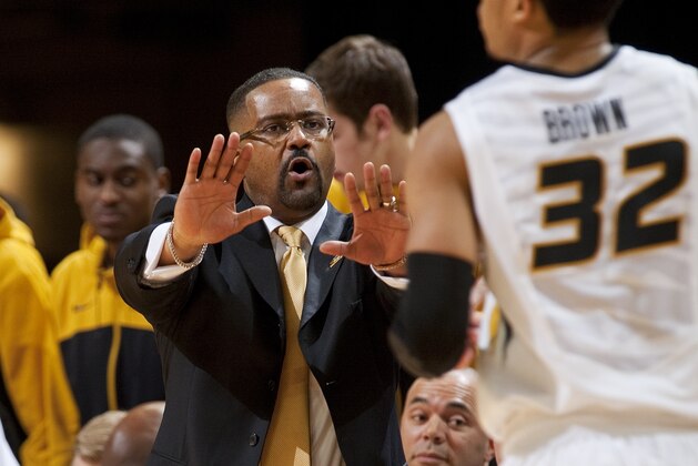 Missouri head coach Frank Haith, left, slows down player Jabari Brown, right, as he brings the ball up court  during the second half of an NCAA college basketball game against Vanderbilt, Wednesday, Feb. 19, 2014, in Columbia, Mo. Missouri won the game 67-64. (AP Photo/L.G. Patterson)