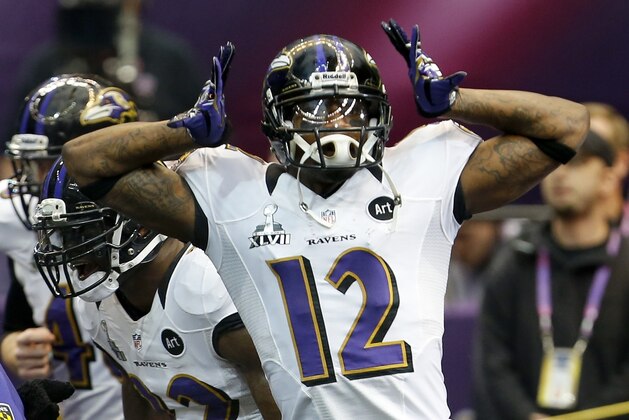 Baltimore Ravens wide receiver Jacoby Jones runs onto the field before the NFL Super Bowl XLVII football game against the San Francisco 49ers Sunday, Feb. 3, 2013, in New Orleans. (AP Photo/Julio Cortez)