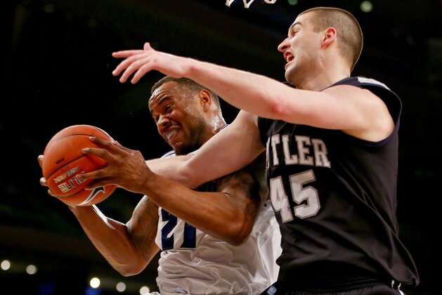 NEW YORK, NY - MARCH 12:  Gene Teague #21 of the Seton Hall Pirates grabs the rebound before Andrew Chrabascz #45 of the Butler Bulldogs during the first round of the Big East Basketball Tournament at Madison Square Garden on March 12, 2014 in New York City.  (Photo by Elsa/Getty Images)