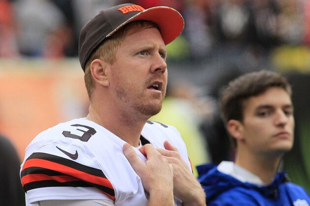 Cleveland Browns quarterback Brandon Weeden watches from the sidelines in an NFL football game against the Cincinnati Bengals, Sunday, Nov. 17, 2013, in Cincinnati. (AP Photo/Tom Uhlman)