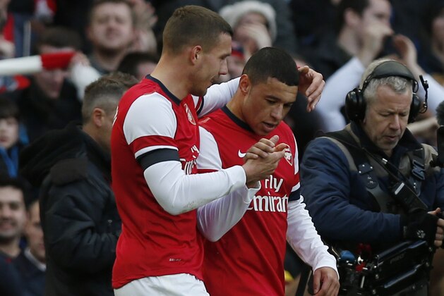 Arsenal's Alex Oxlade-Chamberlain, right, celebrates his goal against Liverpool with teammate Lukas Podolski during their English FA Cup fifth round soccer match at Emirates Stadium in London, Sunday, Feb. 16, 2014. (AP Photo/Sang Tan) Arsenal's Alex Oxlade-Chamberlain, right, celebrates his goal against Liverpool with teammate Lukas Podolski during their English FA Cup fifth round soccer match at Emirates Stadium in London, Sunday, Feb. 16, 2014. (AP Photo/Sang Tan)