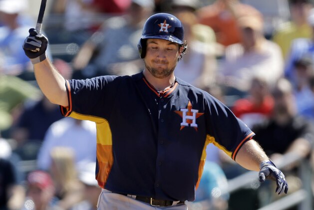 Houston Astros' Brett Wallace reacts after striking out swinging during the fourth inning of an exhibition spring training baseball game against the Miami Marlins Monday, March 3, 2014, in Jupiter, Fla. (AP Photo/Jeff Roberson)