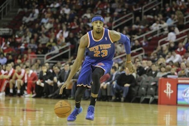 New York Knicks guard Toure Murry (23) drives the ball during the first half of an NBA basketball game against the Houston Rockets, Friday, Jan. 3, 2014, in Houston. (AP Photo/Patric Schneider)