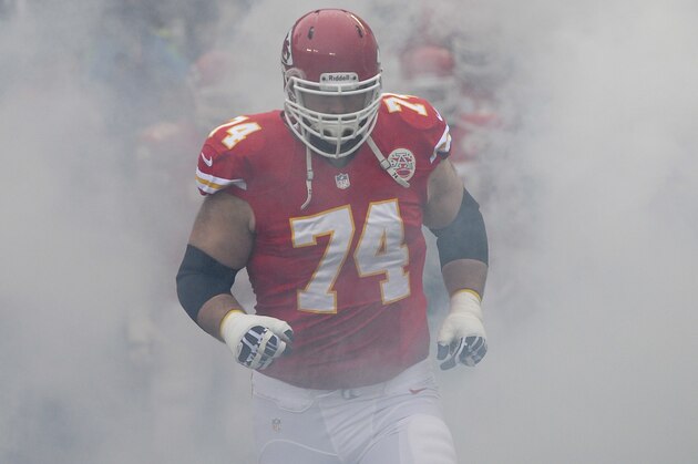 Kansas City Chiefs guard Geoff Schwartz (74) runs onto the field during introductions before their NFL game against the Indianapolis Colts at Arrowhead Stadium in Kansas City, Mo., Sunday, Dec. 22, 2013. (AP Photo/Reed Hoffmann)