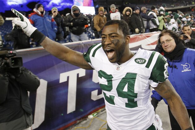 New York Jets cornerback Darrelle Revis celebrates his team's 28-21 win over the New England Patriots in an NFL divisional playoff football game in Foxborough, Mass., Sunday, Jan. 16, 2011.  (AP Photo/Winslow Townson)