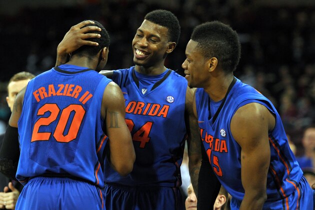 COLUMBIA, SC - MARCH 04: Casey Prather #24 and Will Yeguete #15 congratulate Michael Frazier II #20 of the Florida Gators near the end of their game against the South Carolina Gamecocks at Colonial Life Arena on March 4, 2014 in Columbia, South Carolina. Florida defeated South Carolina 72-46. (Photo by Lance King/Getty Images)