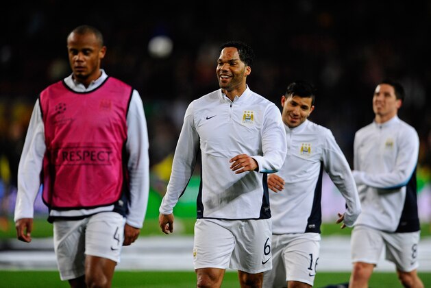 BARCELONA, SPAIN - MARCH 12: (L-R) Vincent Kompany, Joleon Lescott, Sergio Aguero and Sami Nasri of Manchester City warm up prior to kickoff during the UEFA Champions League Round of 16, second leg match between FC Barcelona and Manchester City at Camp Nou on March 12, 2014 in Barcelona, Spain. (Photo by David Ramos/Getty Images) BARCELONA, SPAIN - MARCH 12: (L-R) Vincent Kompany, Joleon Lescott, Sergio Aguero and Sami Nasri of Manchester City warm up prior to kickoff during the UEFA Champions League Round of 16, second leg match between FC Barcelona and Manchester City at Camp Nou on March 12, 2014 in Barcelona, Spain. (Photo by David Ramos/Getty Images)