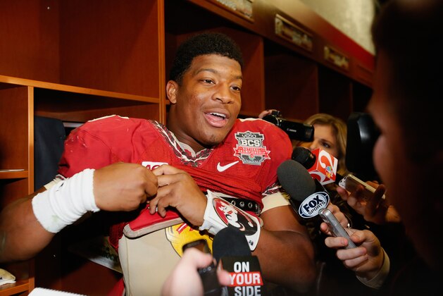 PASADENA, CA - JANUARY 06:  Quarterback Jameis Winston #5 of the Florida State Seminoles celebrates in the locker room after defeating the Auburn Tigers 34-31 in the 2014 Vizio BCS National Championship Game at the Rose Bowl on January 6, 2014 in Pasadena, California.  (Photo by Kevin C. Cox/Getty Images)